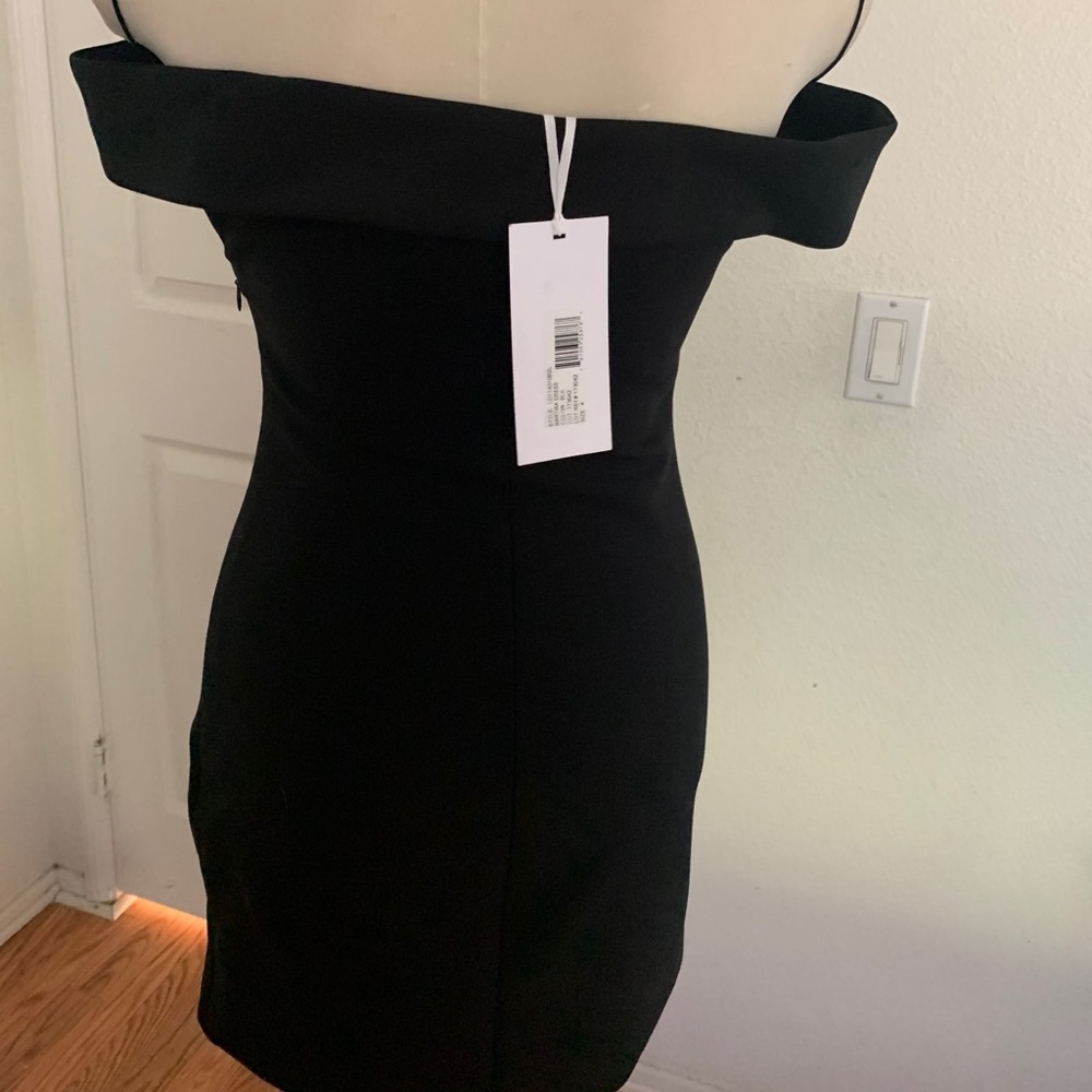 Off the shoulder black dress.